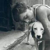 Boy Hugging a Dog